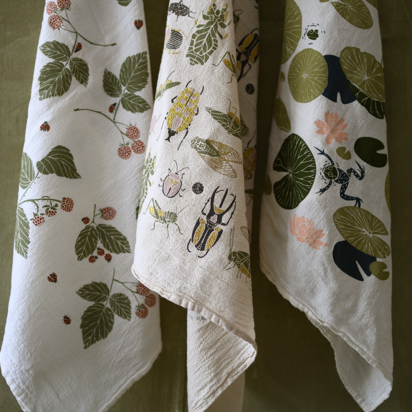 Kitchen tea towel made with eco-friendly flour sack in the usa featuring natural botanical lily pad and frog artwork by june & december artist katie forte
