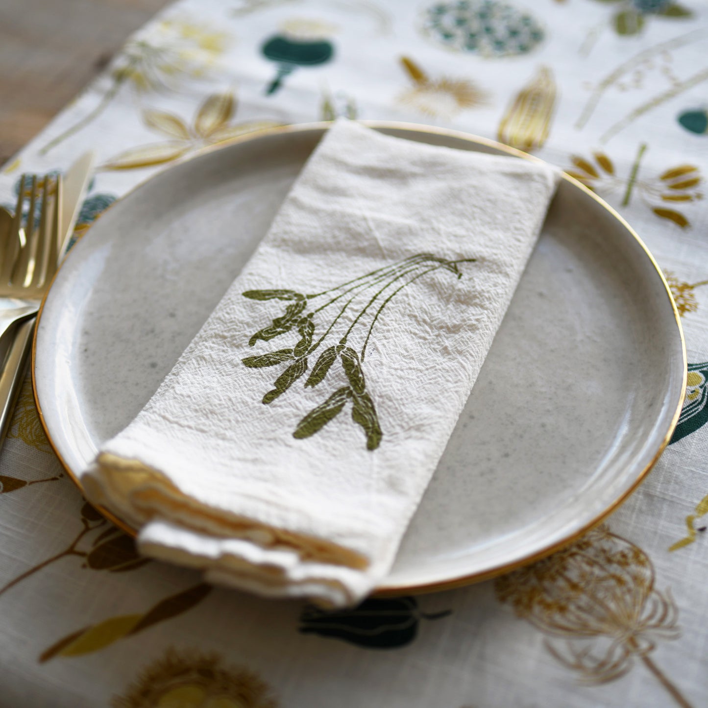 Designer Magnolia Table Runner with organic cotton featuring  botanical nature seed pods design by June & December artist Katie Forte