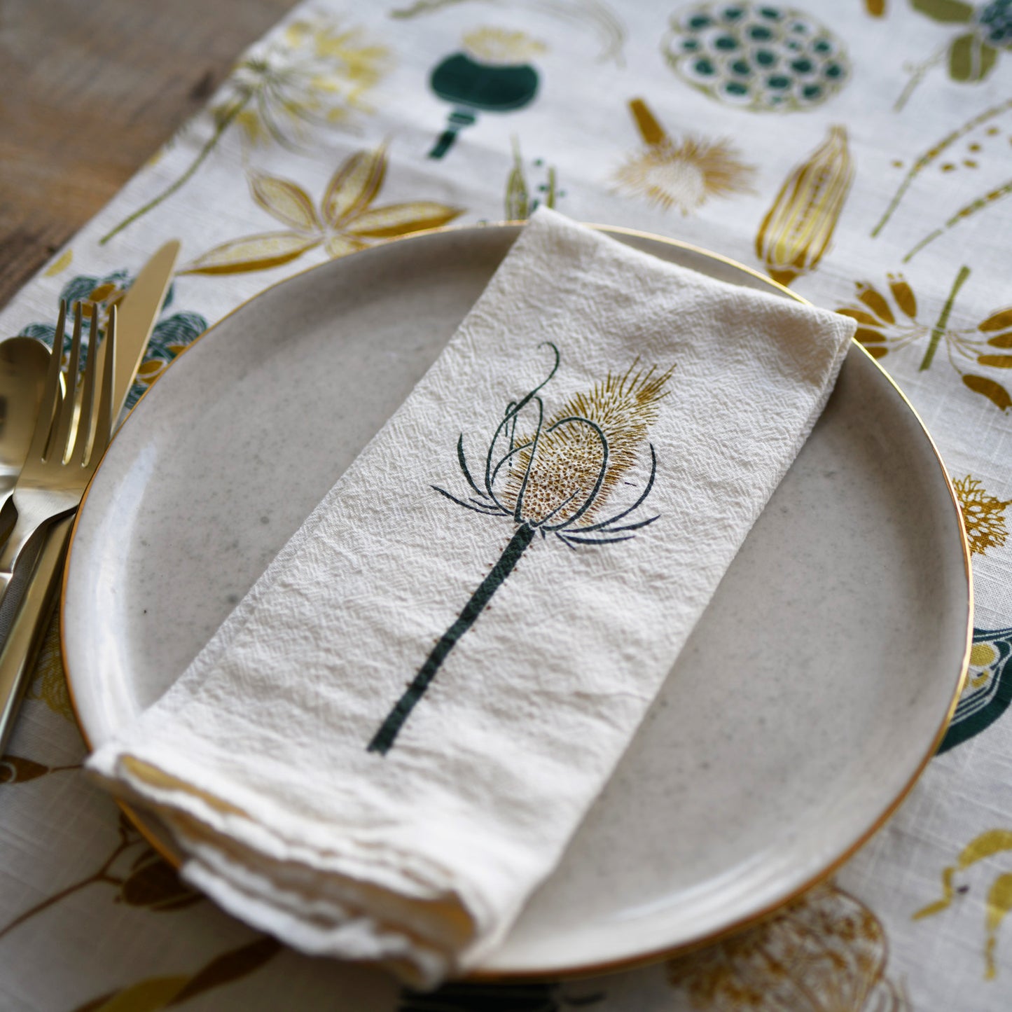 Cloth dinner napkins made with eco-friendly flour sack in the USA, featuring botanical teasle + poppy artwork by June & December artist Katie Forte