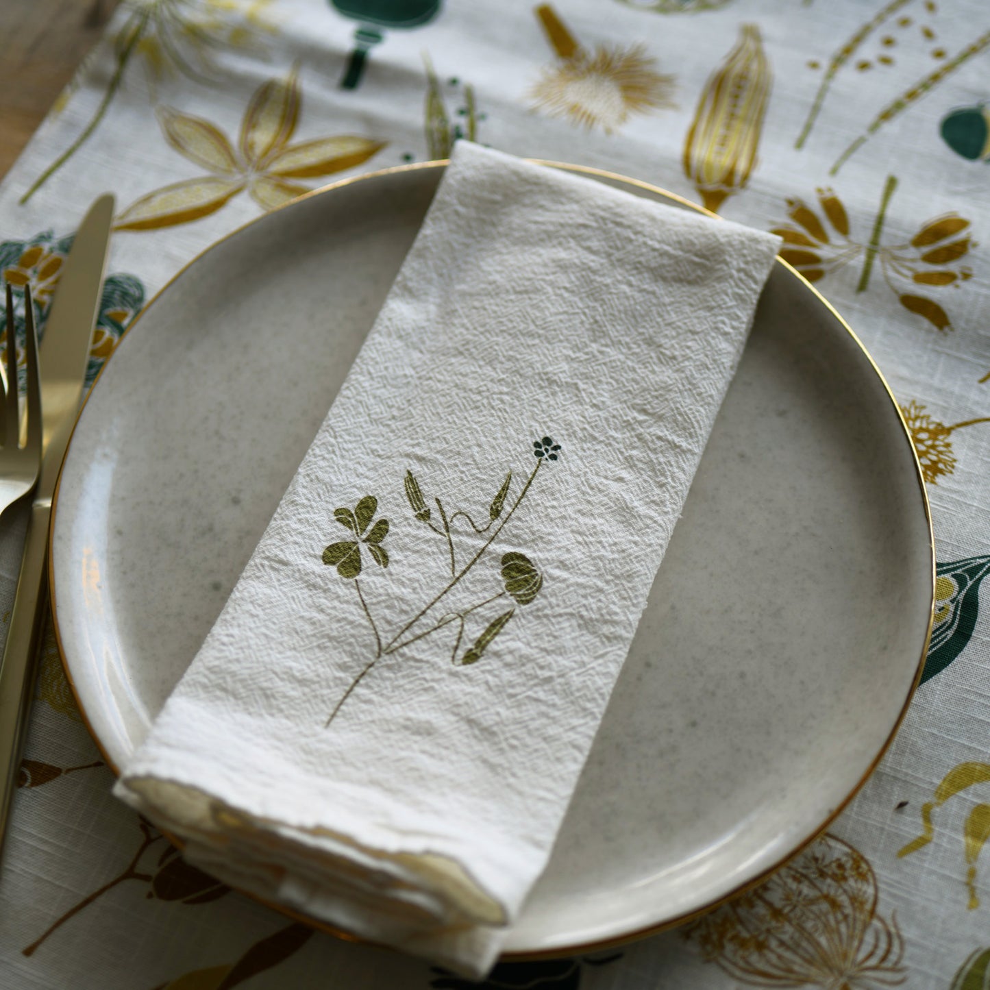 Cloth napkin flour sack with Wood Sorrel wildflower design for a spring dinner, designed by katie forte of june & december