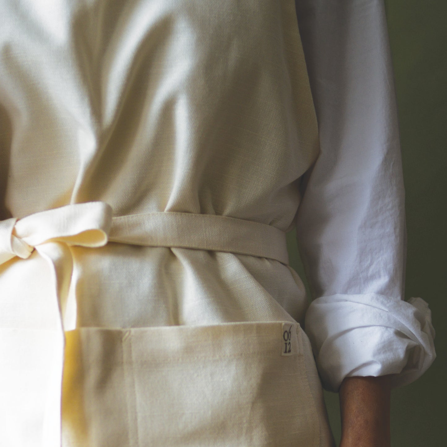 Designer Kitchen and Garden Apron with organic cotton featuring willow thicket chickadee bird art by june & december artist Katie Forte