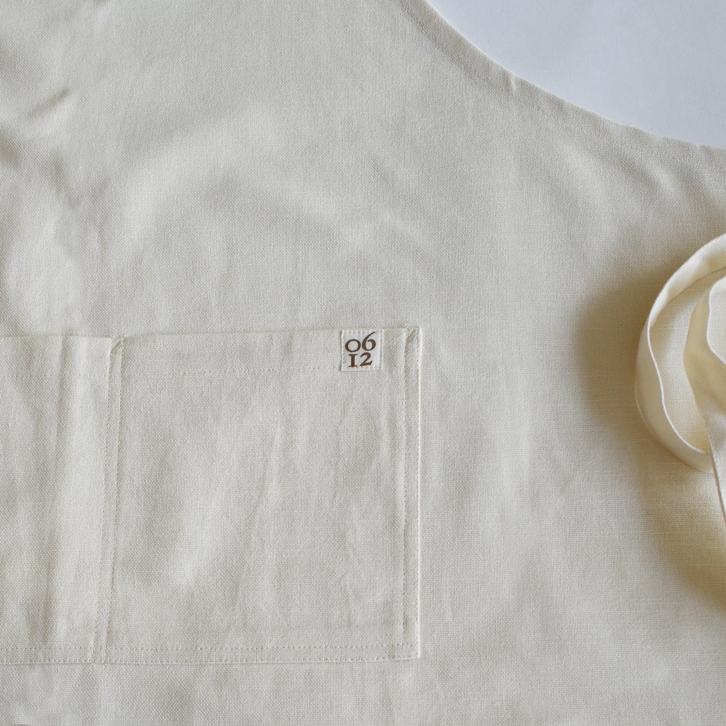 Designer Garden and Kitchen Apron with organic cotton featuring willow thicket bird artwork by june & december artist Katie Forte