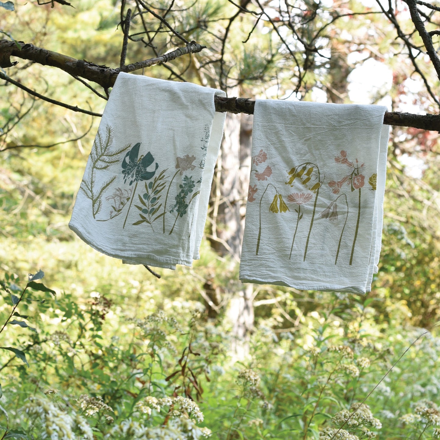Flour sack tea towel displaying the Harmony & Unity flower, designed by Katie Forte of june & december