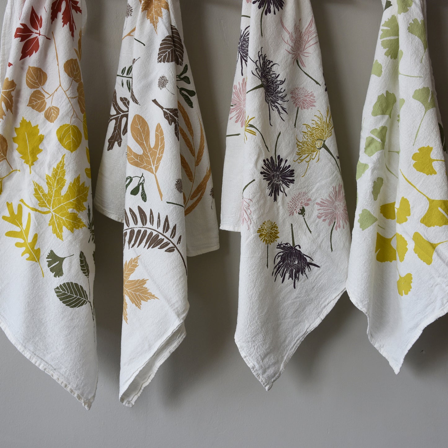 Tea towel made of flour sack showcasing the beautiful Transitions between the seasons, designed by Katie Forte of june & december