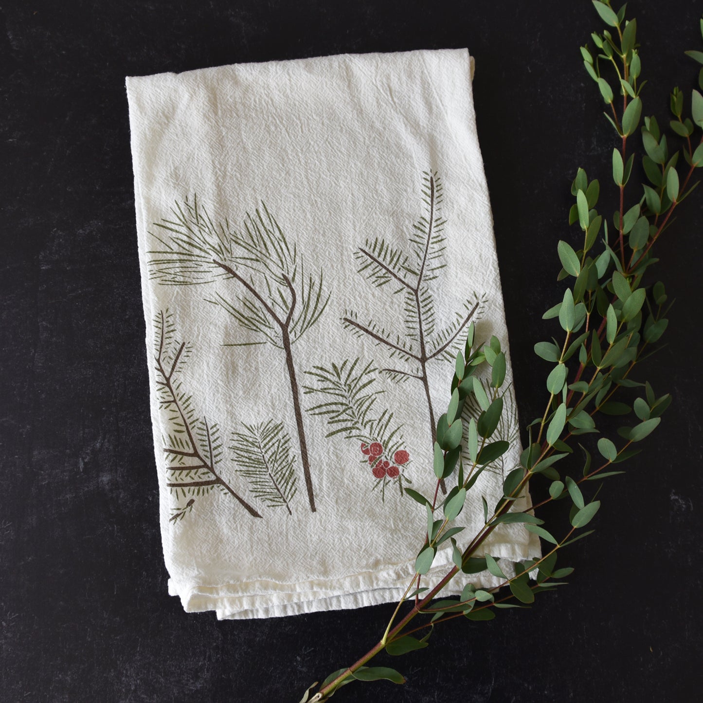 Kitchen tea towel with a holiday Conifers design, designed by Katie Forte of june & december