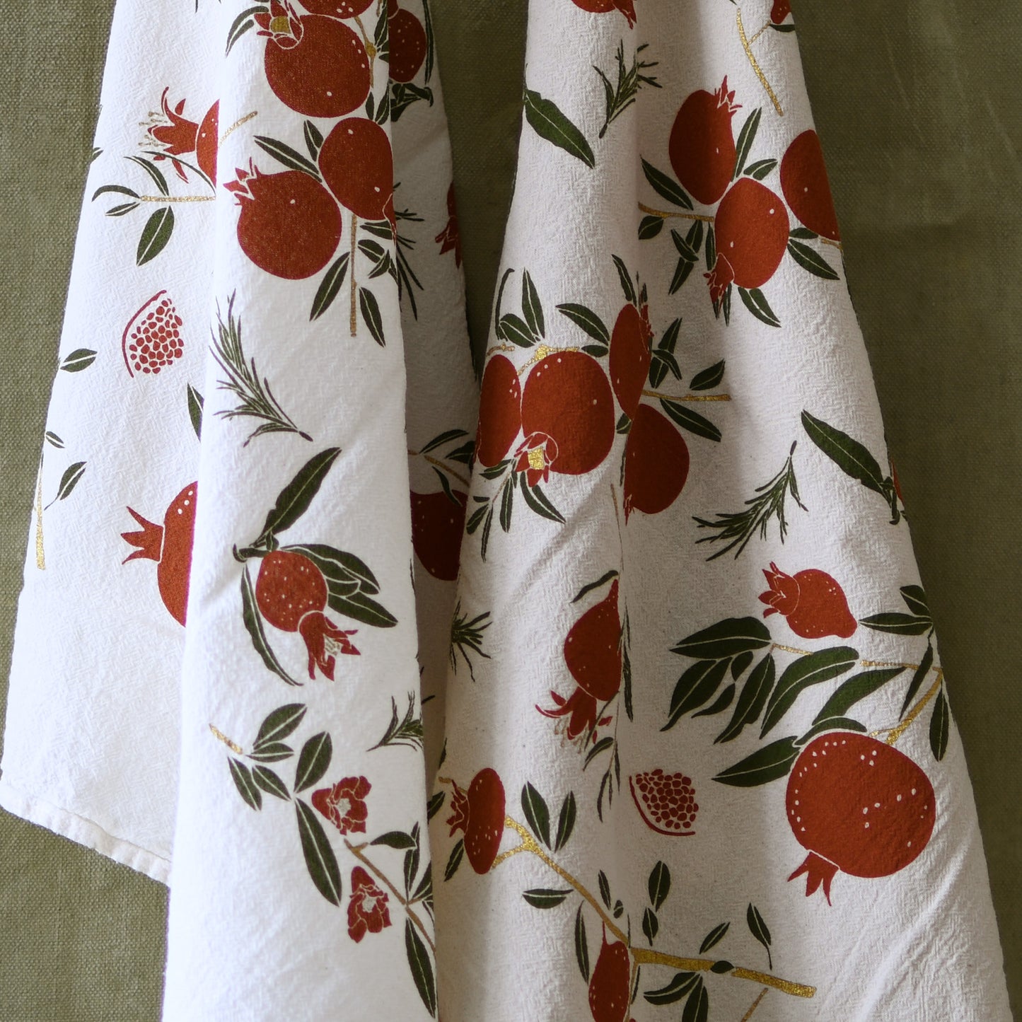 Eco-friendly flour sack kitchen tea towel made in the usa with natural Pomegranate holiday artwork by june & december artist katie forte