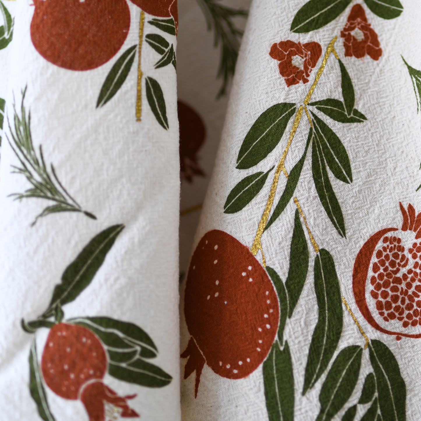 Eco-friendly flour sack kitchen tea towel made in the usa with botanical Pomegranate holiday artwork by june & december artist katie forte