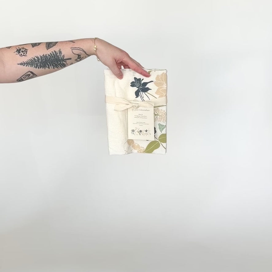 Load and play video in Gallery viewer, Video featuring our Language of Flowers tea towel, with Peace flowers design, printed on flour sack cotton. Designed by Katie Forte of June &amp;amp; December
