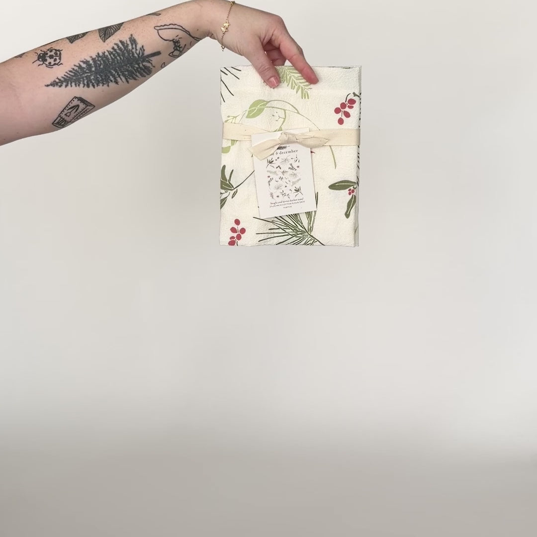 Load and play video in Gallery viewer, Video featuring our Boughs and Berries tea towel design, made from flour sack cotton, perfect addition for the holiday season. Designed by Katie Forte of June &amp;amp; December
