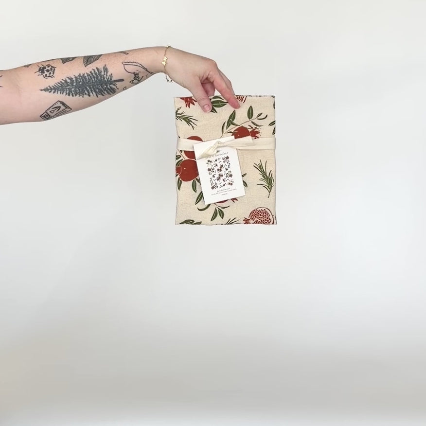Load and play video in Gallery viewer, Video showing our Poms tea towel design in natural, featuring gold glitter accents, and printed on flour sack cotton. Designed by Katie Forte of June &amp;amp; December
