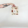 Video showing our Poms tea towel design in natural, featuring gold glitter accents, and printed on flour sack cotton. Designed by Katie Forte of June & December