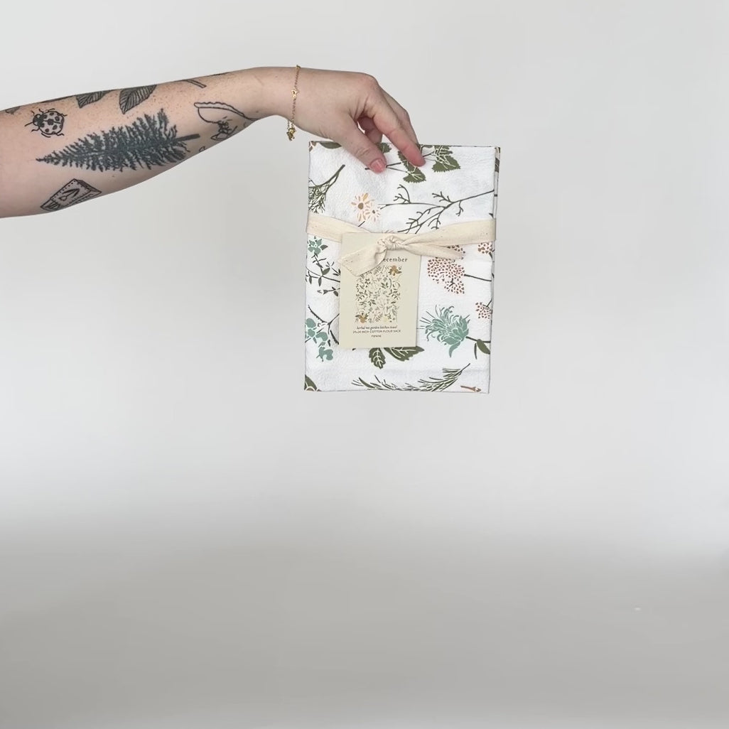 Load and play video in Gallery viewer, Video featuring our Herbal Tea Garden tea towel design, made from flour sack cotton, and designed by Katie Forte of June &amp;amp; December
