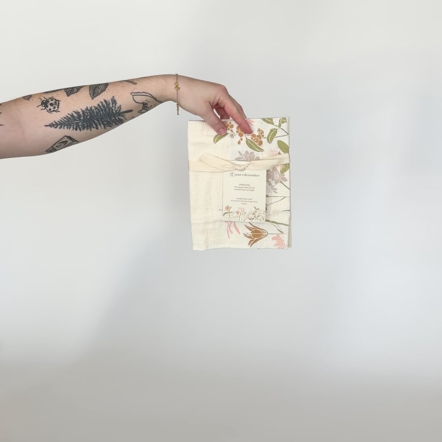 Load and play video in Gallery viewer, Video featuring our Language of Flowers tea towel, with Strength flowers design, printed on flour sack cotton, designed by Katie Forte of June &amp;amp; December
