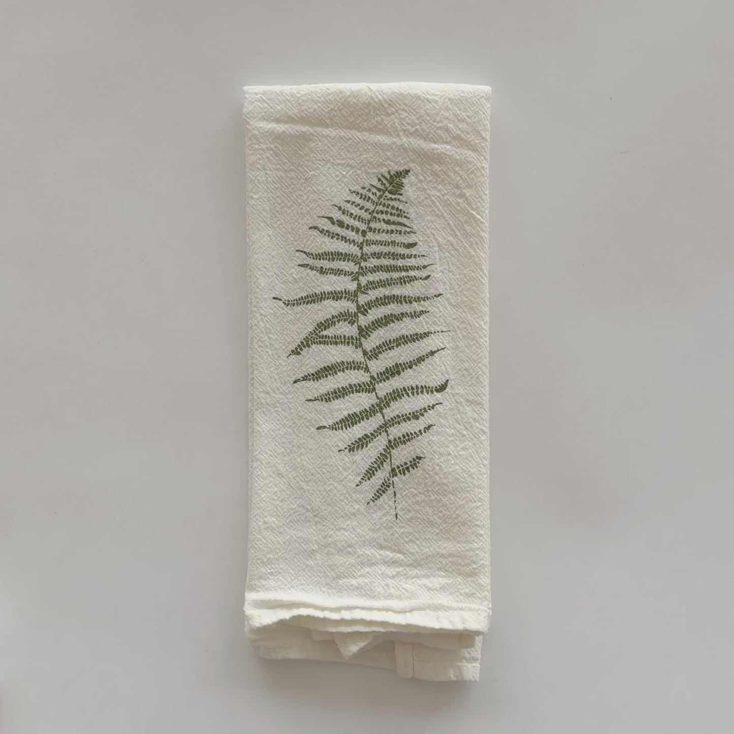 Load and play video in Gallery viewer, Video featuring an eco-friendly cloth napkin with a Wood Fern and Resurrection Fern design, designed by Katie Forte of June &amp;amp; December
