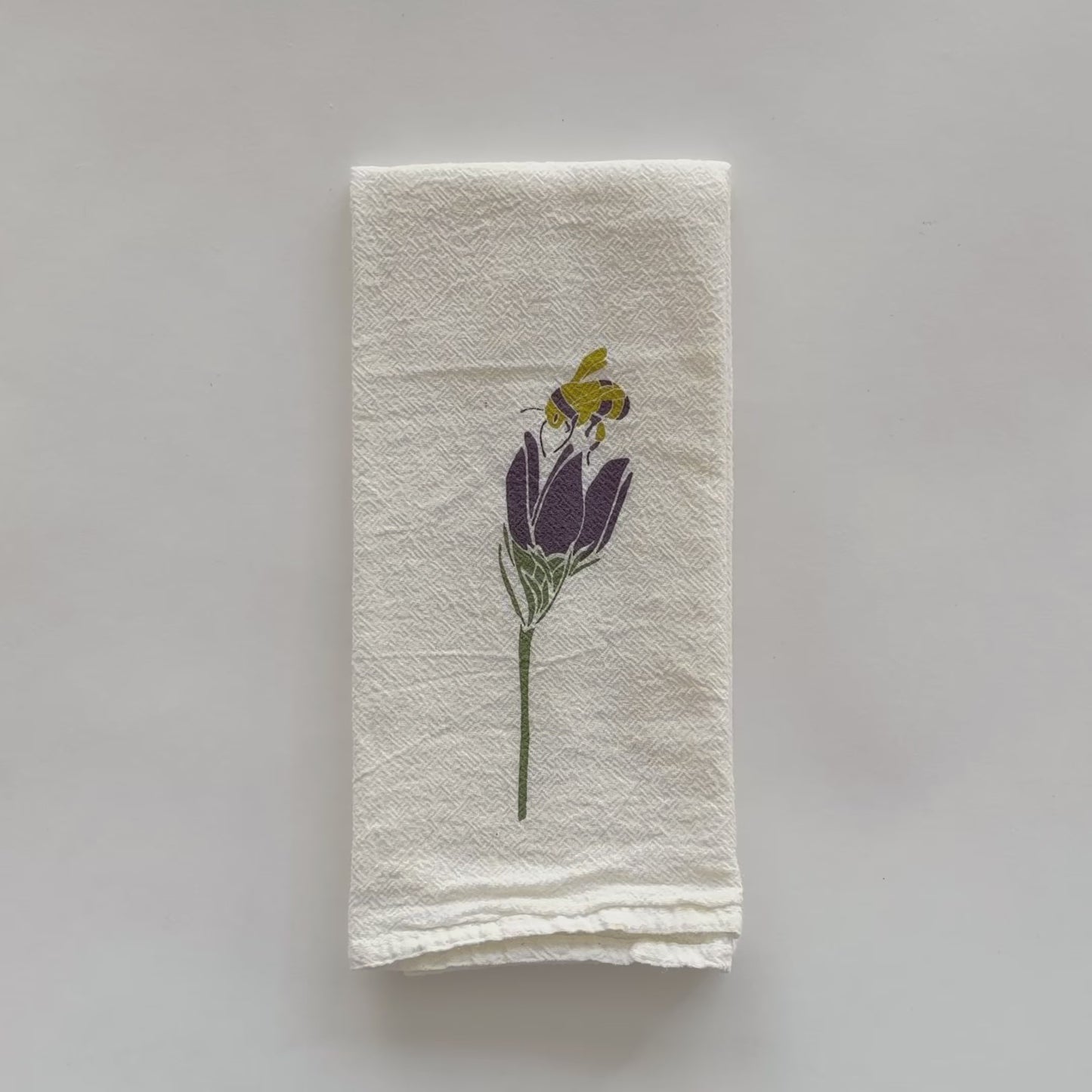 Video showing both sides of our Foxglove and Crocus design that's printed on an eco-friendly cloth napkin, designed by Katie Forte of June & December