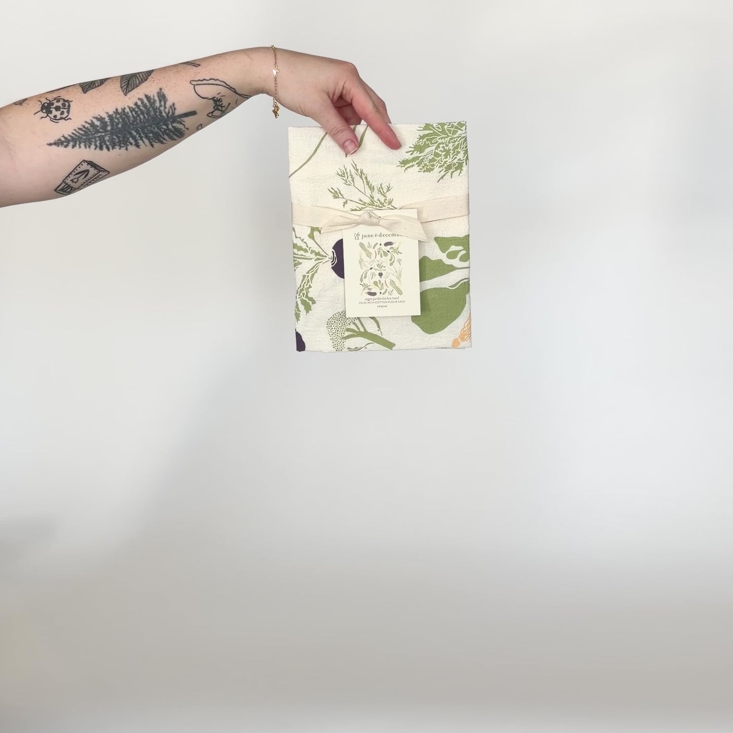 Load and play video in Gallery viewer, Video featuring our Veggie Garden tea towel design. Screen printed on flour sack cotton, a perfect gift for a fresh garden pick. Designed by Katie Forte of June &amp;amp; December
