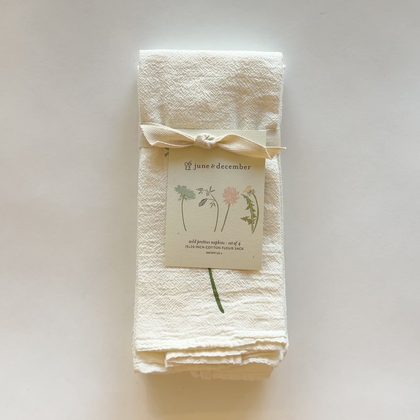 Load and play video in Gallery viewer, Video featuring our perfect for spring, Wild Pretties cloth napkin set, made out of flour sack cotton, designed by Katie Forte of June &amp;amp; December
