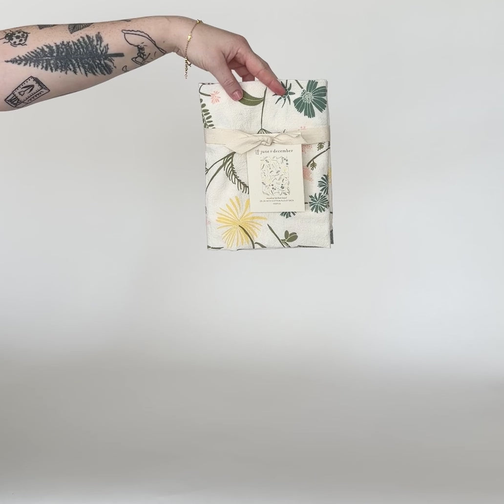 Load and play video in Gallery viewer, Video featuring our Meadow tea towel design. Screen printed on flour sack cotton, perfect gift to help welcome the blossoming of the flowers. Designed by Katie Forte of June &amp;amp; December
