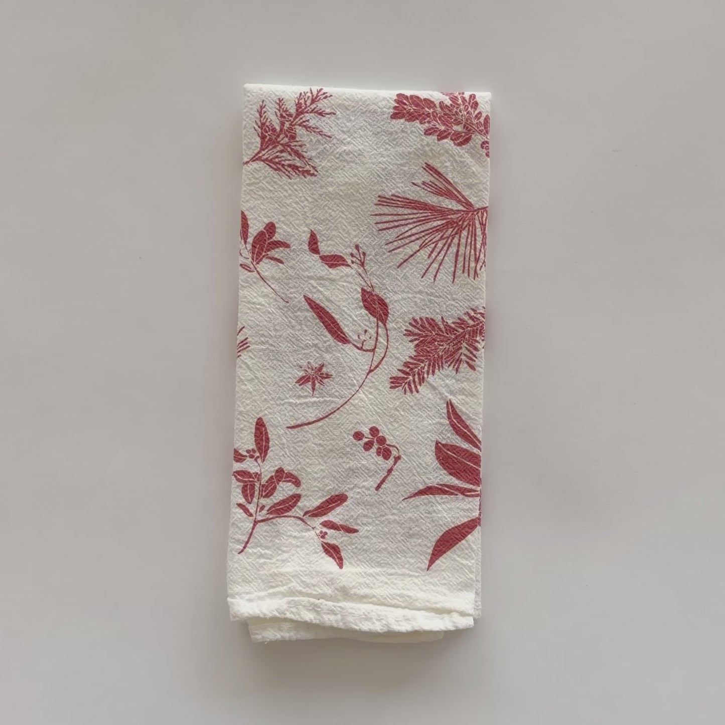 Load and play video in Gallery viewer, Video featuring our Red Boughs &amp;amp; Berries design, printed on an eco-friendly cloth napkin, designed by Katie Forte of June &amp;amp; December
