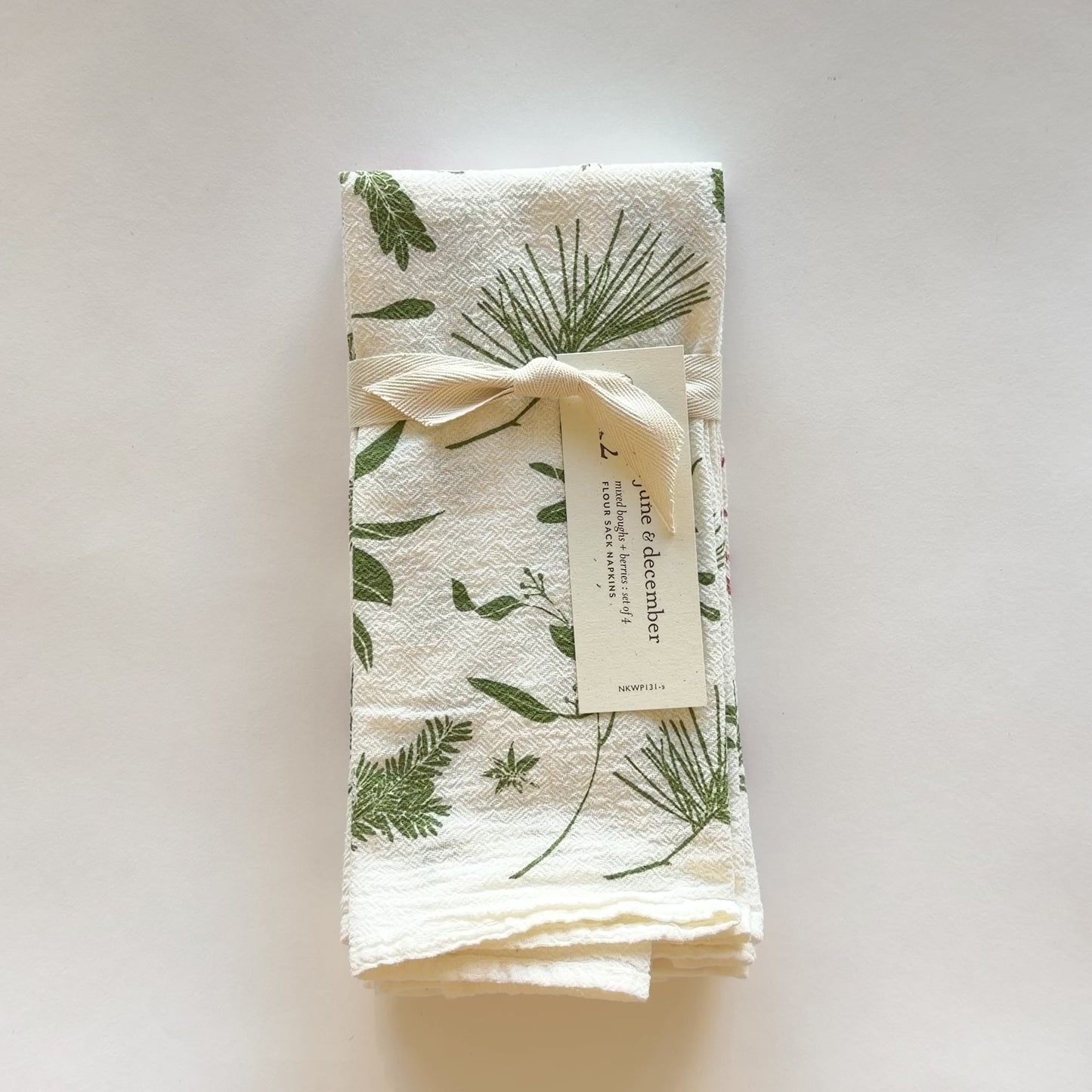 Load and play video in Gallery viewer, Video featuring our Mixed Boughs and Berries cloth napkin set, printed on flour sack cotton, perfect for the holidays. Designed by Katie Forte of June &amp;amp; December
