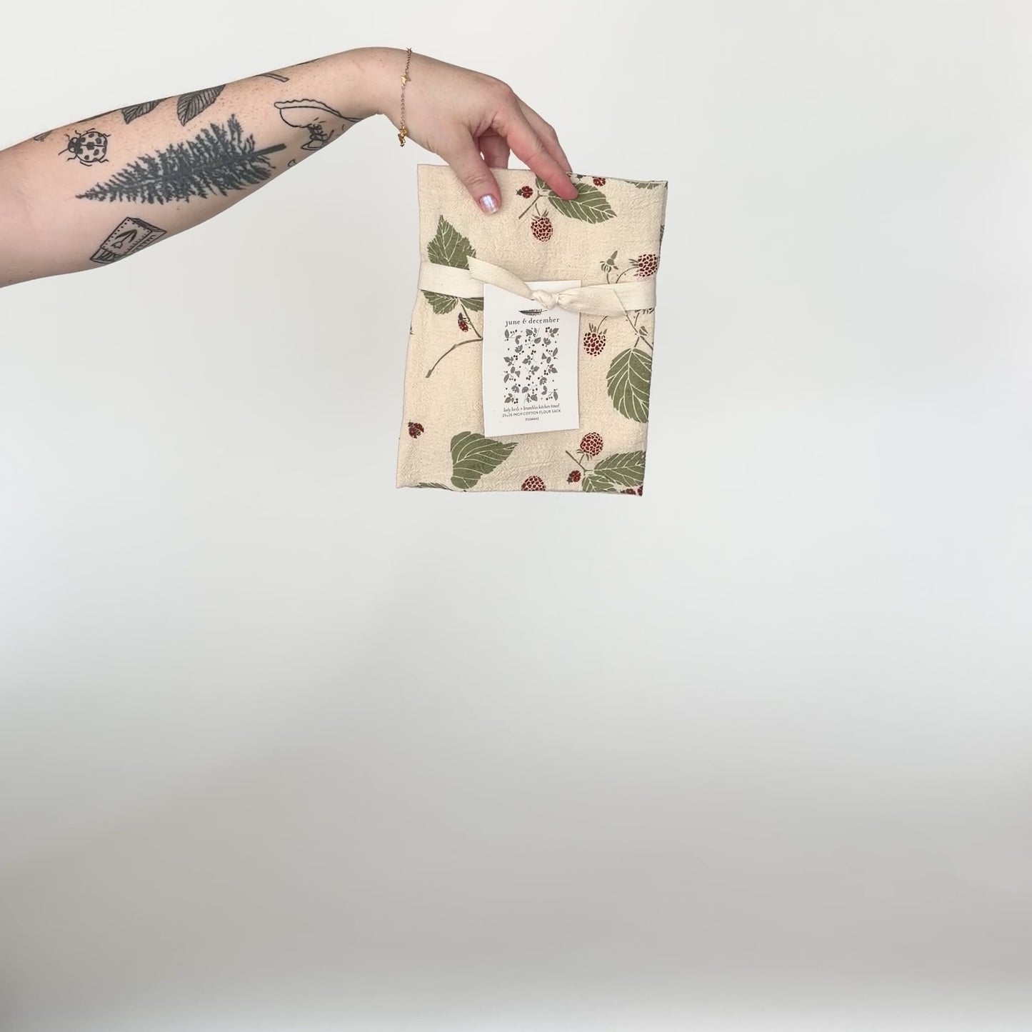 Load and play video in Gallery viewer, Video featuring our Lady Birds and Brambles tea towel design in natural. Screen printed on flour sack cotton. Designed by Katie Forte of June &amp;amp; December
