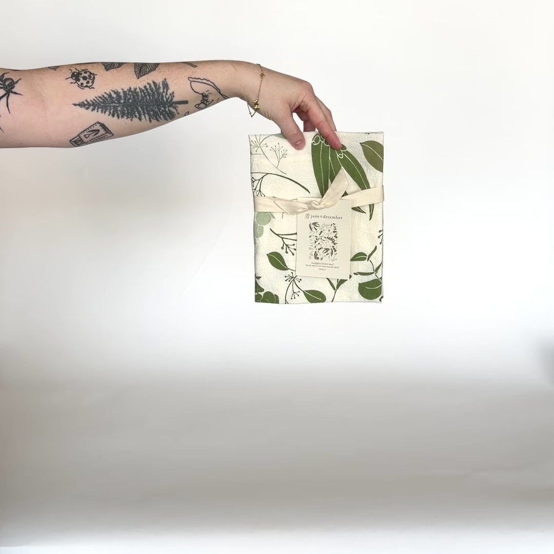 Load and play video in Gallery viewer, Video featuring our Eucalyptus tea towel design, made from flour sack cotton, designed by Katie Forte of June &amp;amp; December
