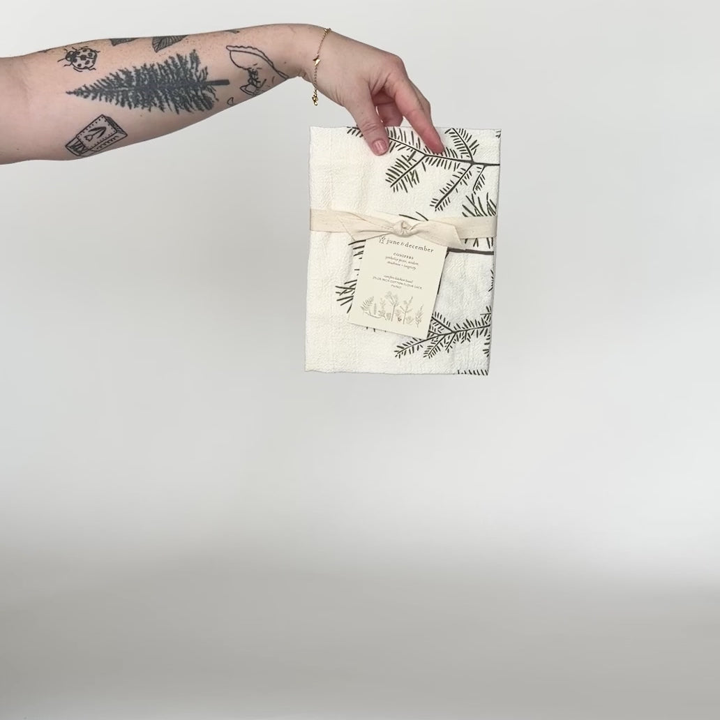Load and play video in Gallery viewer, Video featuring our Conifers tea towel design, made from flour sack cotton, designed by Katie Forte of June &amp;amp; December
