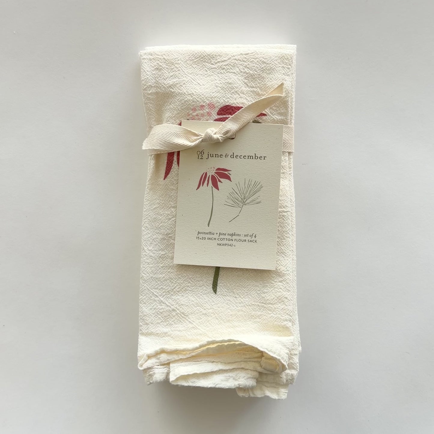 Load and play video in Gallery viewer, Video featuring our Poinsettia and Pine cloth napkins, made from flour sack cotton, perfect for the holiday season. Designed by Katie Forte of June &amp;amp; December
