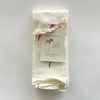 Video featuring our Poinsettia and Pine cloth napkins, made from flour sack cotton, perfect for the holiday season. Designed by Katie Forte of June & December