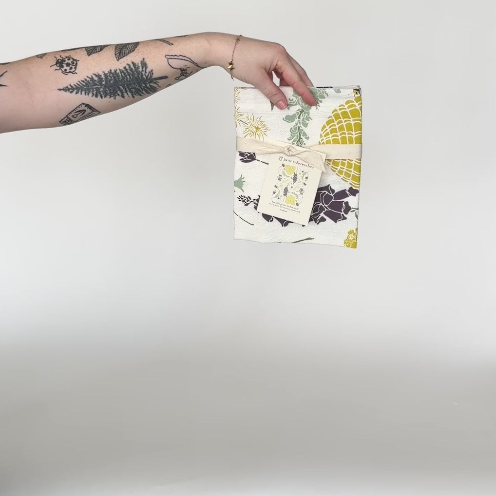 Load and play video in Gallery viewer, Video featuring our Honeybee Garden tea towel design, screen printed on flour cotton sack. Perfect pollinator gift. Designed by Katie Forte of June &amp;amp; December
