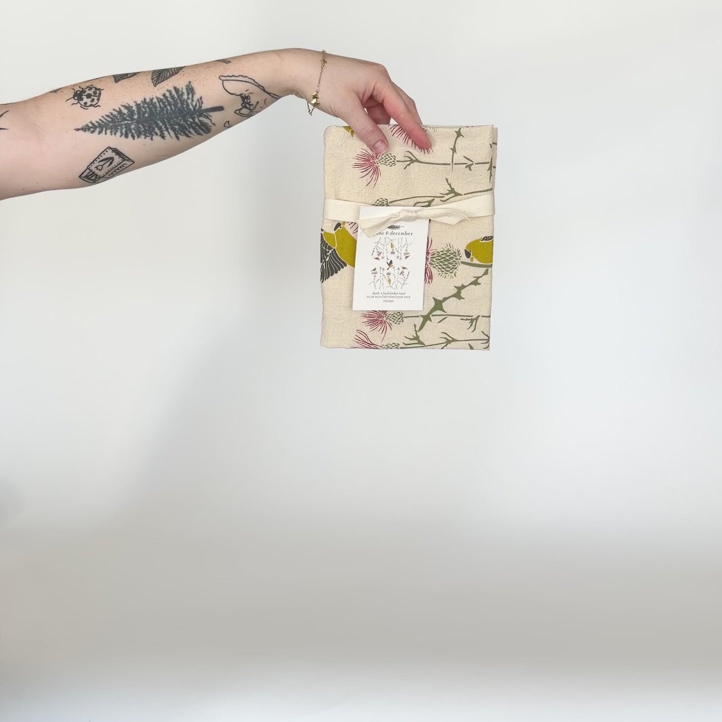 Load and play video in Gallery viewer, Video featuring our Thistle and Finch design tea towel in natural, made from flour sack cotton, designed by Katie Forte of June &amp;amp; December
