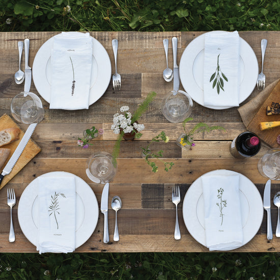 Cloth dinner napkins made with eco-friendly flour sack in the USA, featuring botanical artwork by June & December artist Katie Forte